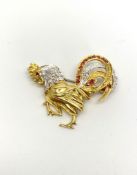 18CT DIAMOND AND RUBY COCKEREL BROOCH, dimensions estimated as 36x30mms , total weight 8.2gms, not