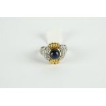 18CT TWO TONE CABOCHON SAPPHIRE AND DIAMOND RING, centre stones estimated as 6.5 mm, diamonds