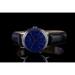 GENTLEMENS GIRARD PERREGAUX WRISTWATCH, circular blue dial with bronze hour markers, pencil hands