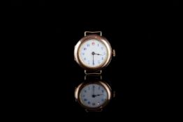 LADIES 9CT GOLD TRENH WRISTWATCH, circular white dial with blue Arabic numerals and a red twelve,