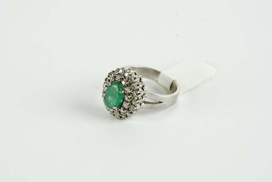 18CT WHITE GOLD EMERALD AND DIAMOND CLUSTER RING,centre stone estimated as 9.2x 3.48mm, diamonds - Image 2 of 2