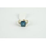 9CT BLUE TOPAZ AND DIAMOND DRESS RING, centre stone estimated as 10x10mm, total diamond weight
