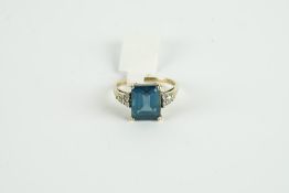 9CT BLUE TOPAZ AND DIAMOND DRESS RING, centre stone estimated as 10x10mm, total diamond weight