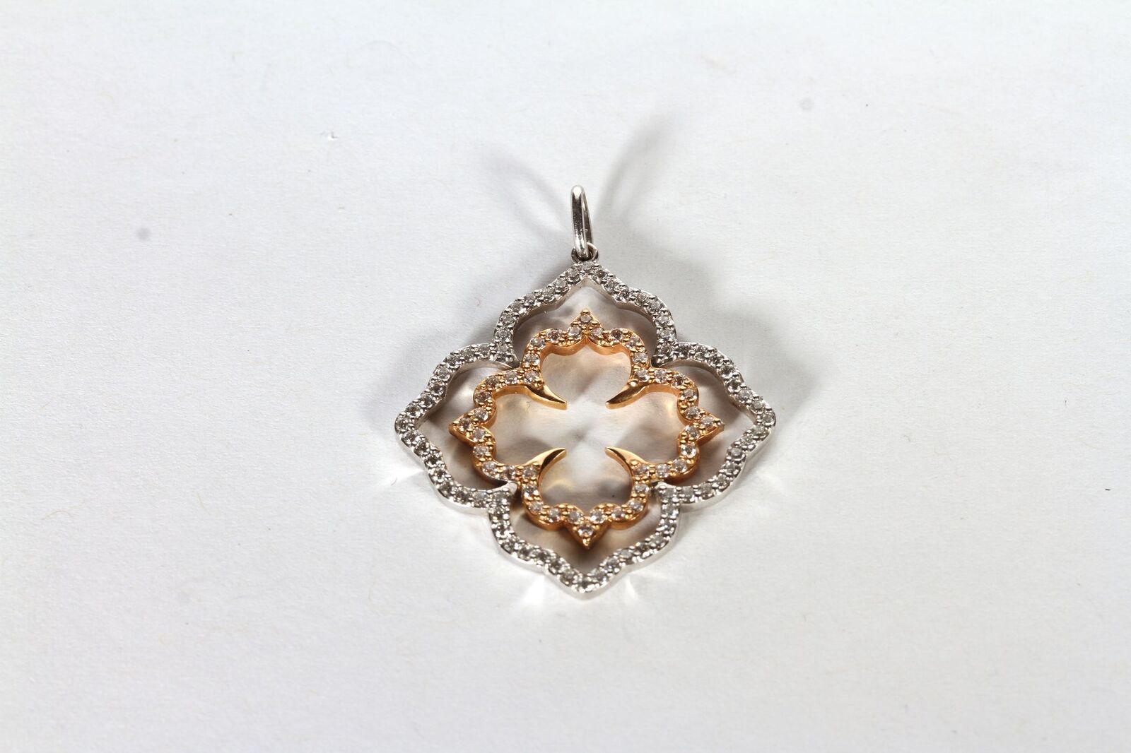8CT WHITE GOLD AND ROSE GOLD FLOWER PENDANT, SET WITH AN ESTIMATED 0.75CT OF DIAMONDS, dimensions