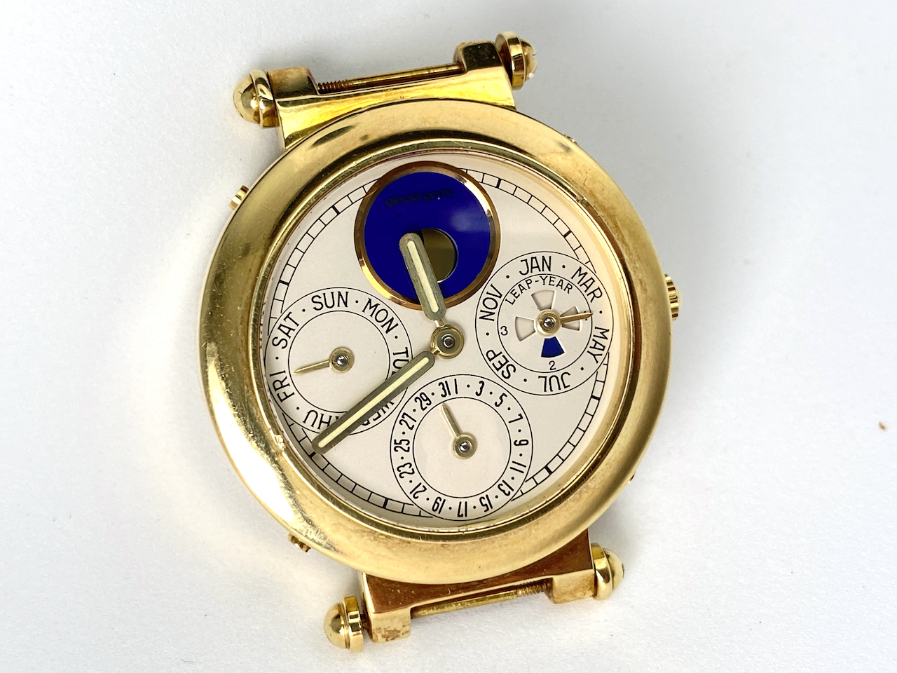 18CT GERALD GENTA PERPETUAL CALENDAR WATCH,HEAD ONLY, round, creme dial with illuminated gold