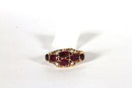 Victorian Garnet and Seed Pearl Ring, set with 6 garnets and 4 seed pearls, stamped 9ct yellow gold,