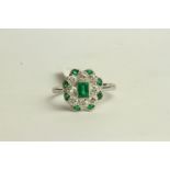 Art Deco Emerald and Diamond Ring, set with a centre emerald, surrounded by 8 diamonds and 8