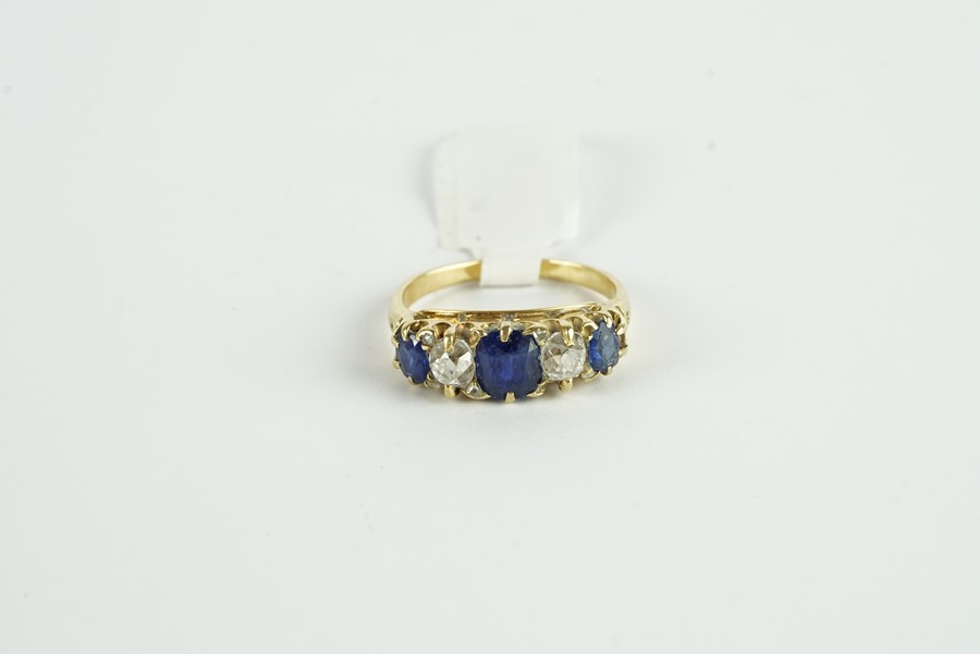 18CT SAPPHIRE AND DIAMOND 5 STONE RING,centre stone estimated as 6.4x5.8mm, diamonds estimated as