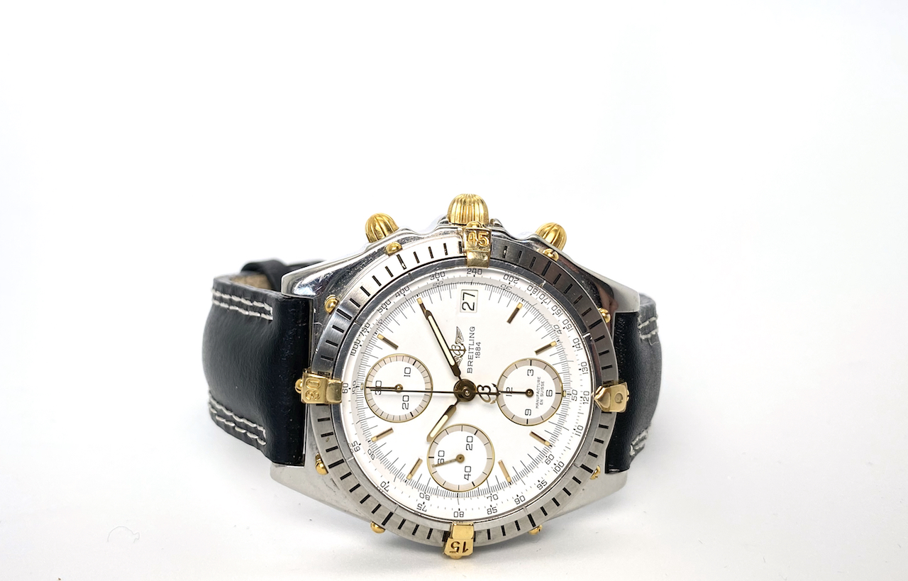 GENTLEMAN'S TWO TONE BREITLING CHRONOMAT MODEL B13047, round,white dial with gold hands, gold