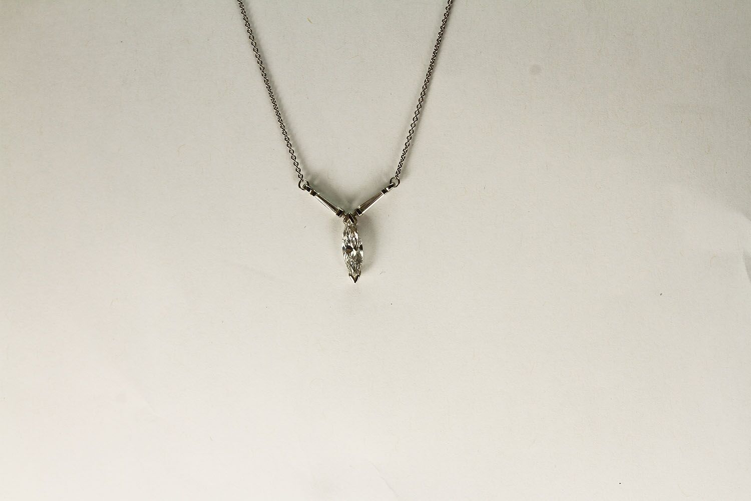 PLATINUM MARQUISE AND BAGUETTE CUT PENDANT, centre stone estimated as 12.6x3.48mm, other 2 stones - Image 2 of 3