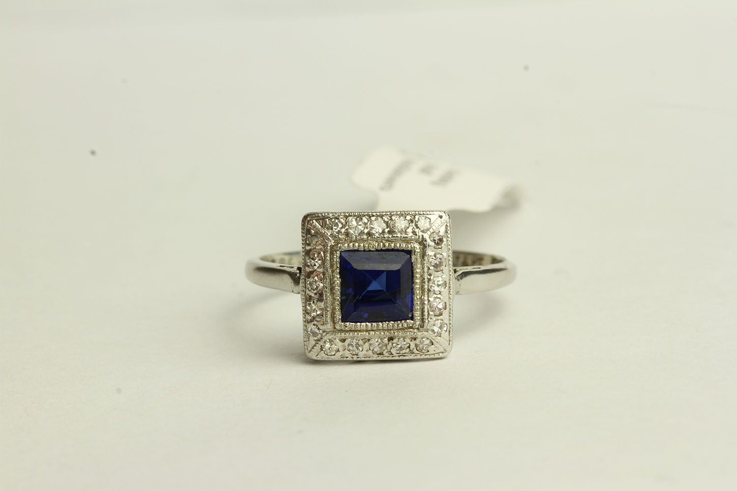 Sapphire and Diamond ring, set with a centre princess cut sapphire approximately 0.93ct,