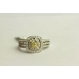 Natural Fancy Yellow and White Diamond Ring, set with 1 cushion cut yellow diamond,