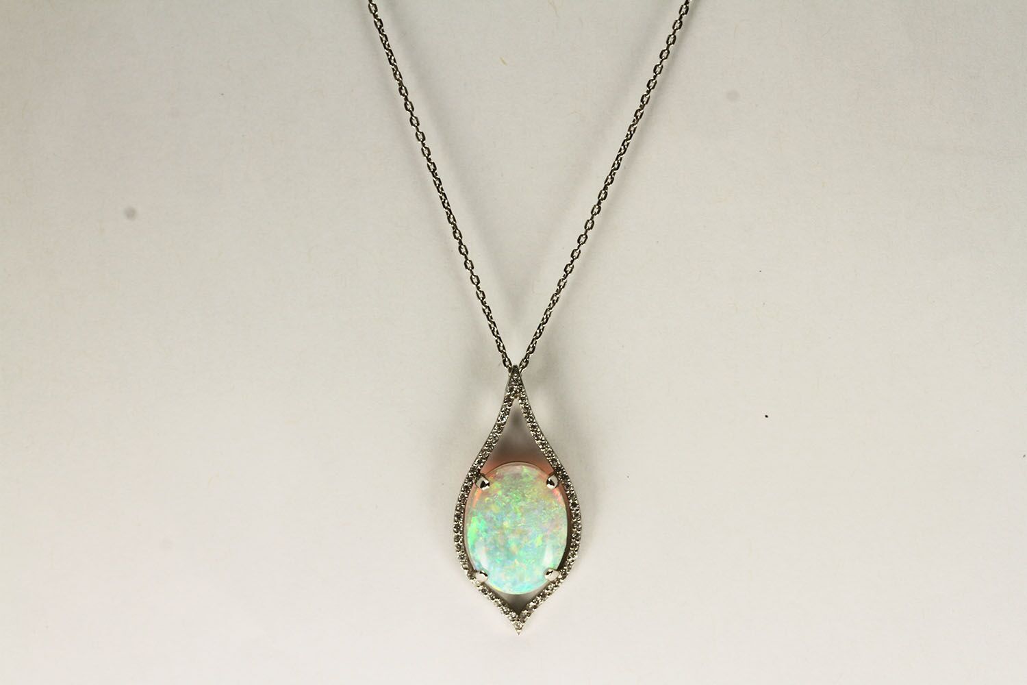 PLATINUM OPAL AND DIAMOND PENDANT , CENTRE STONE ESTIMATED AS 3.47CT,set in four claws, diamonds