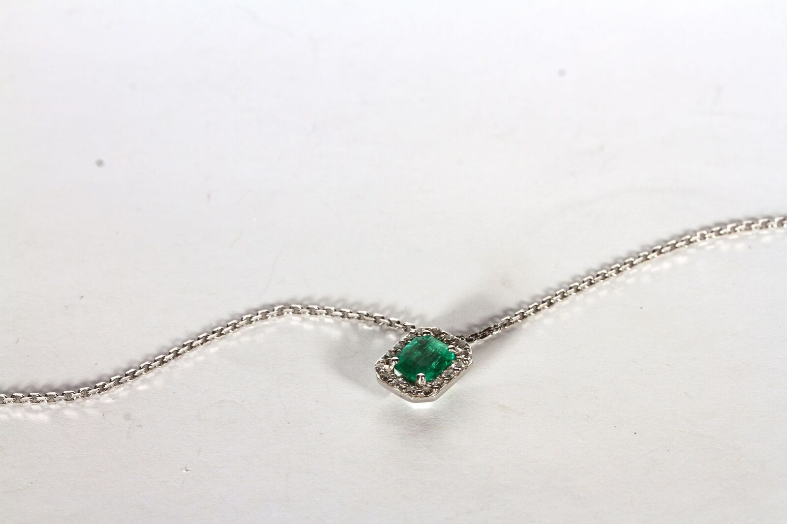 18CT WHITE GOLD EMERALD AND DIAMOND PENDANT, emerald estimated as 5.2 x 5.1mm, diamonds estimated as - Image 2 of 3