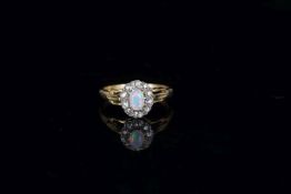 Opal and Old Cut Diamond Cluster RIng, central cabochon Opal, a cluster of old cut diamonds, ring