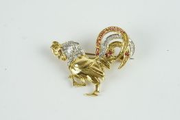 18CT DIAMOND AND RUBY COCKEREL BROOCH, dimensions estimated as 36x30mms , total weight 8.2gms, not