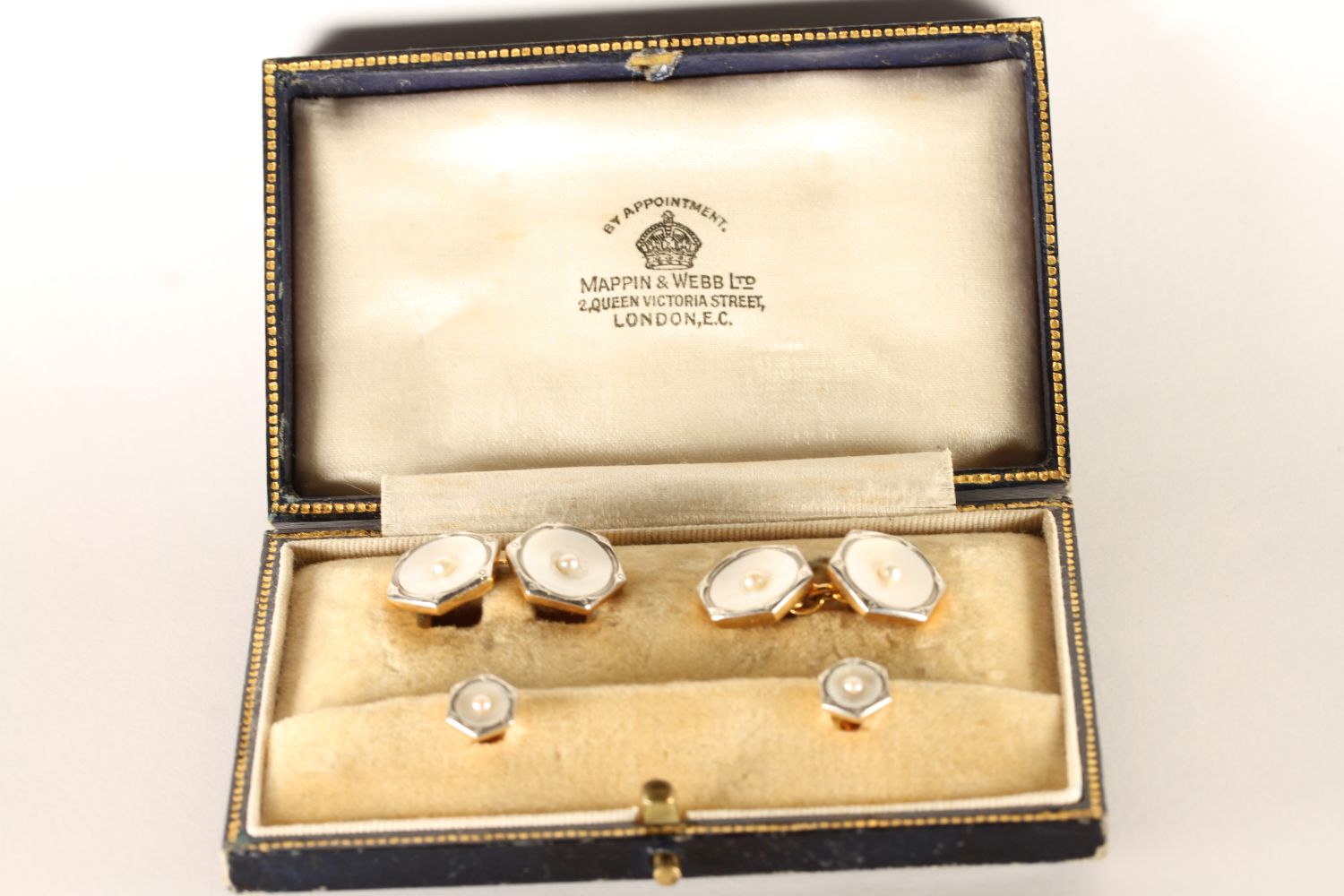 A set of 18ct Mother of Pearl cufflinks with two shirt studs, mappin and webb box, 11.4g gross