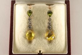 Briolette Peridot Drop Earrings, Briolette cut peridot, suspended from three diamonds, and a further
