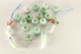 A mixed parcel of Jade beads, discs and carved pieces, white to green, approximately 17 pieces, 32.