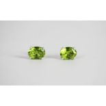 Pair of Peridot Stud Earrings, set with 2 oval cut peridots, 4 claw set, stamped sterling silver