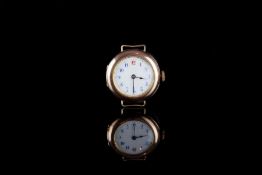 LADIES 9CT GOLD TRENCH WRISTWATCH, circular white dial with blue Arabic numerals and a red twelve,