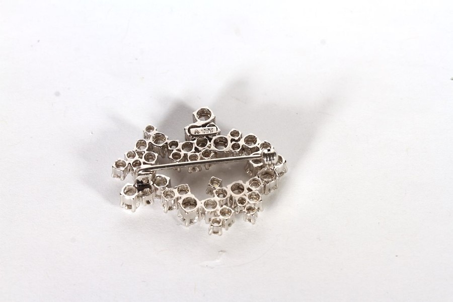 14CT DIAMOND BROOCH FORMED AS AN ABSTRACT SHAPED COCKTAIL BROOCH, set with an estimated 42 round - Image 2 of 2