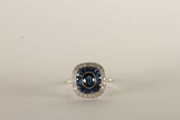 Art Deco Style Sapphire and Diamond Ring, central oval cut sapphire, surrounded by a halo of calibre
