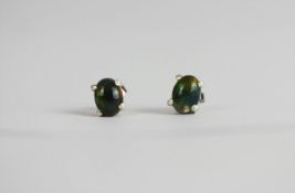 Pair of Black Opal Stud Earrings, set with 2 cabochon cut black opals, 4 claw set, stamped