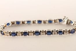 Sapphire and Diamond Bracelet, oval cut sapphires, spaced with panels of baguette cut diamonds,