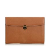 Gucci Leather Clutch Bag, this clutch features a leather body, and a top flap with a push lock