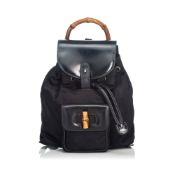 Gucci Bamboo Nylon Drawstring Backpack, this backpack features a nylon body with leather trim,