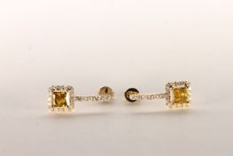 Pair of Yellow Diamond Earrings, set with 2 princess cut yellow diamonds totalling 1.09ct, claw set,