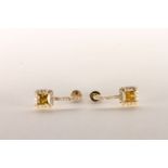 Pair of Yellow Diamond Earrings, set with 2 princess cut yellow diamonds totalling 1.09ct, claw set,
