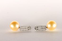 Pair of Pearl and Diamond Drop Earrings, set with 2 golden South Sea Pearls, surrounded by a total