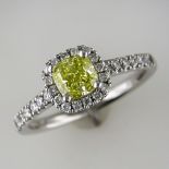 PLATINUM NATURAL INTENSE YELLOW CUSHION SHAPED DIAMOND AND WHITE DIAMOND CLUSTER RING WITH GIA