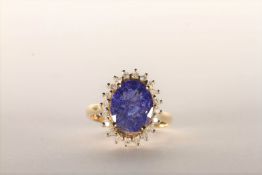 Tanzanite and Diamond Ring, set with an oval cut light violet blue tanzanite totalling 3.07ct, 4