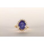 Tanzanite and Diamond Ring, set with an oval cut light violet blue tanzanite totalling 3.07ct, 4