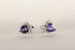 Tanzanite and Diamond Stud Earrings, set with 2 trilliant cut violet blue tanzanites totalling 2.