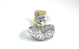 18ct Diamond Set Dress Ring, brilliant and baguette cut diamonds set across a tapering band, in