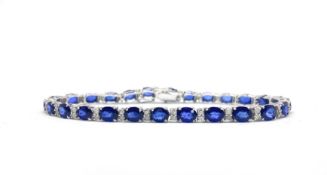 18ct white gold sapphire and diamond line bracelet, boxed. Sapphires 11.91ct. Diamonds 0.65ct