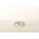 Diamond Ring, centre set with 1 round brilliant cut diamond, claw set, shoulders set with baguette