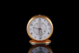 VINTAGE JAEGER 8 DAYS ALARM TRAVEL CLOCK, circular off white two tone dial with gold Arabic numerals