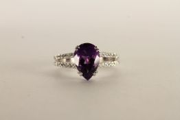 Amethyst and Diamond Ring, set with a pear shaped amethyst, claw set, shoulders set with two rows of