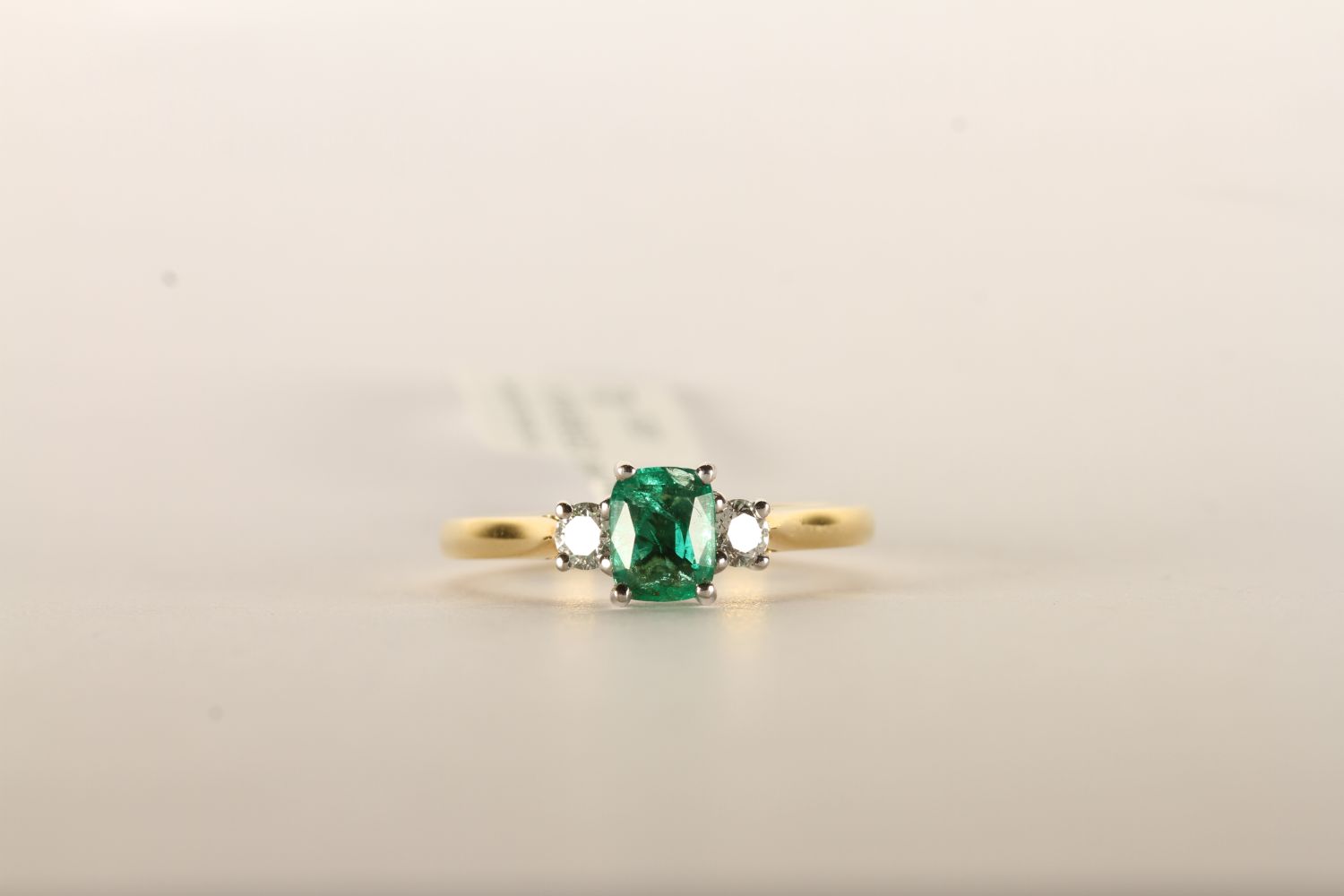 Emerald and Diamond Trilogy Ring, set with a singl