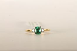 Emerald and Diamond Trilogy Ring, set with a singl