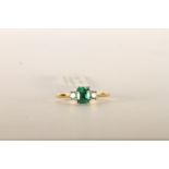 Emerald and Diamond Trilogy Ring, set with a singl