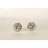 Pair of Diamond Cluster Earrings, centre set with diamonds in a flower shape, surrounded by 2 layers