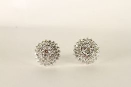 Pair of Diamond Cluster Earrings, centre set with diamonds in a flower shape, surrounded by 2 layers