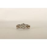 Diamond Flower Ring, set with 7 round brilliant cut diamonds, claw set, finger size F. please note