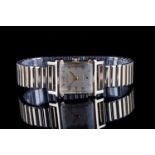 GENTLEMENS WITTNAUER WRISTWATCH, rectangular gold dial with gold hour markers and hands,